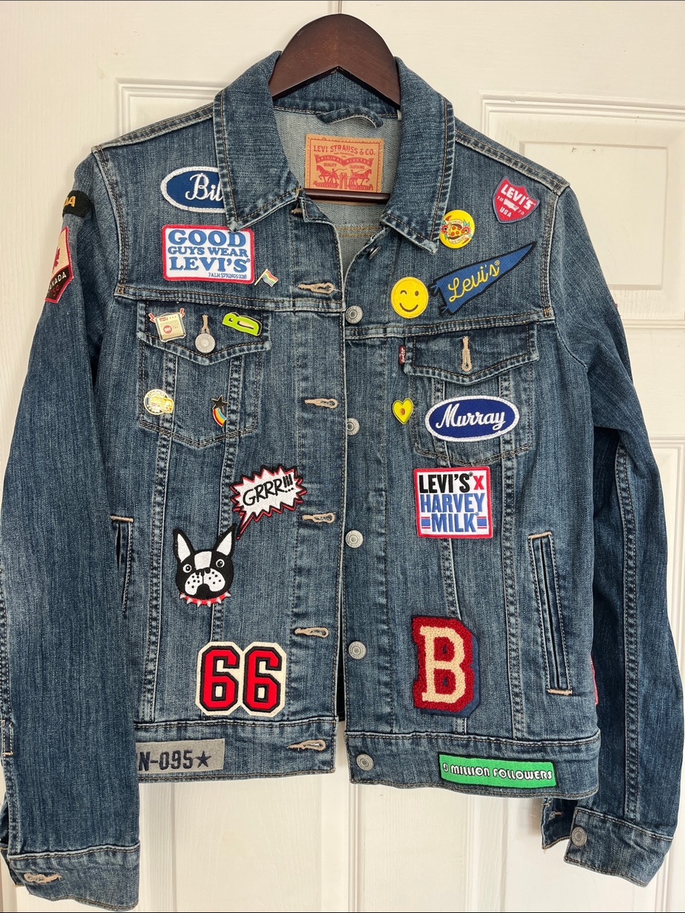 Levi's Blue Denim Trucker Jacket with Multicolor Patches and pins